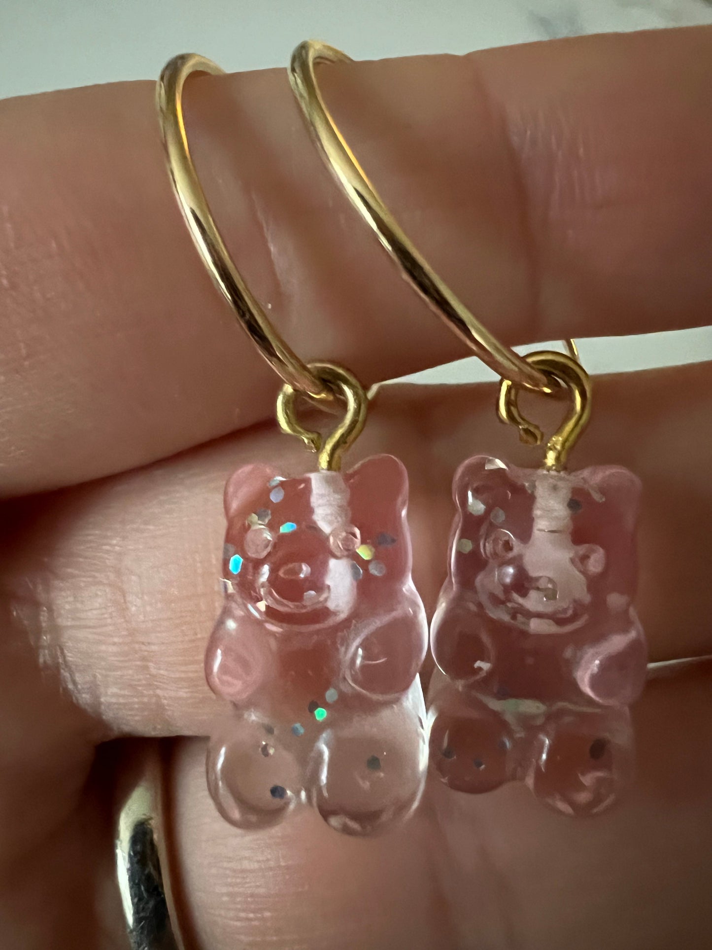Mini sparkly pink gummy bears in gold fill hoops