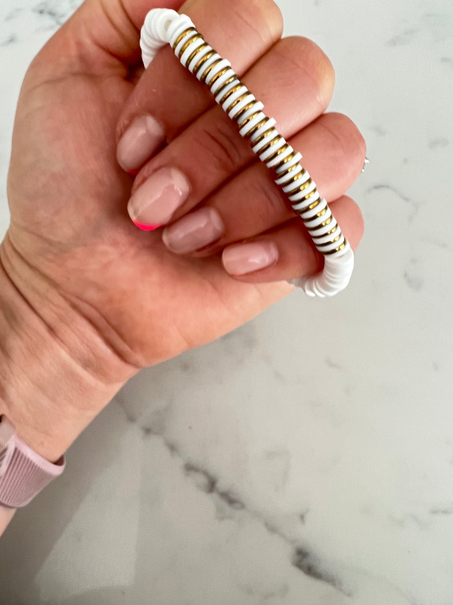 Gold and white heishi bead bracelet.