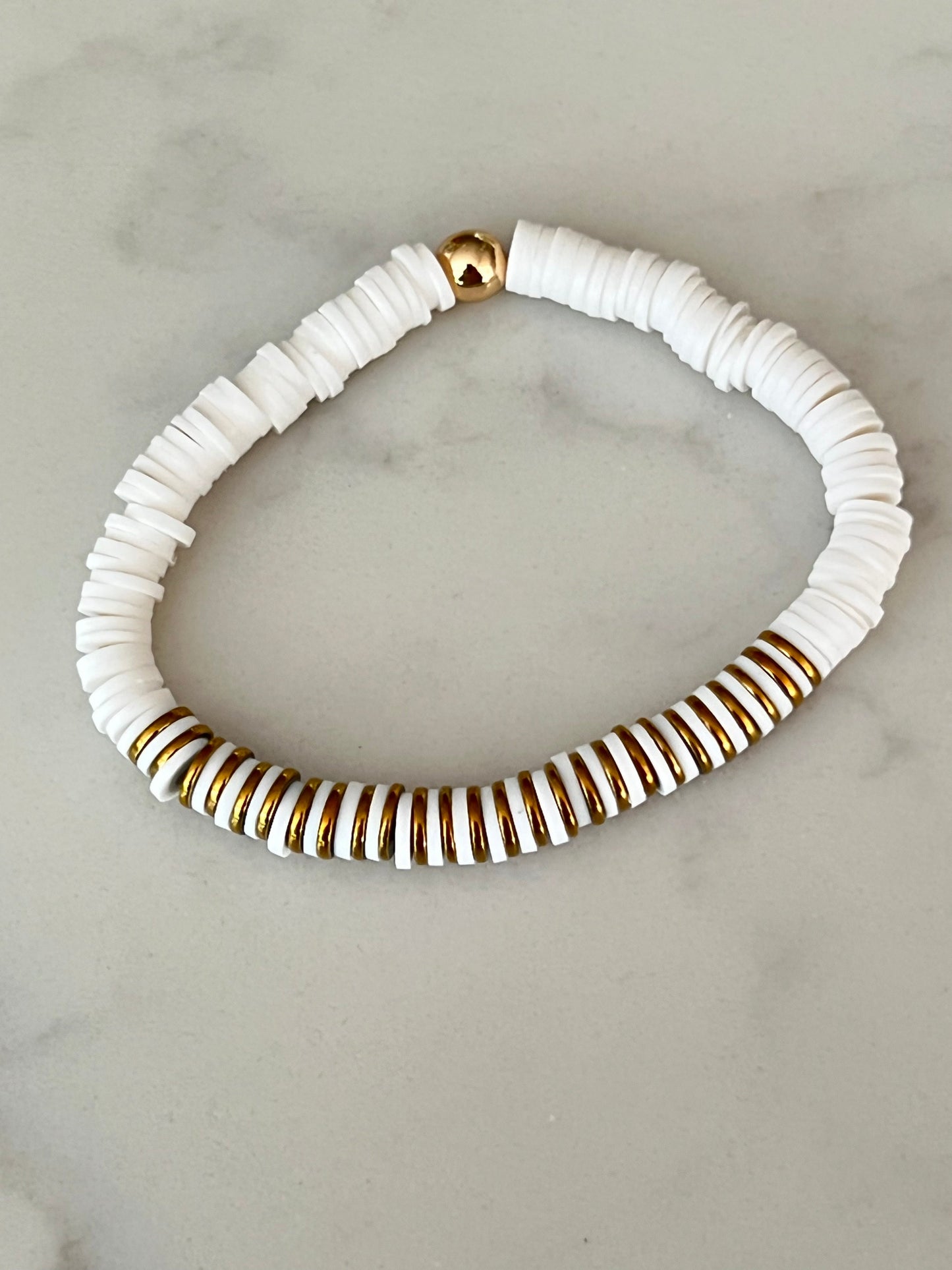 Gold and white heishi bead bracelet.
