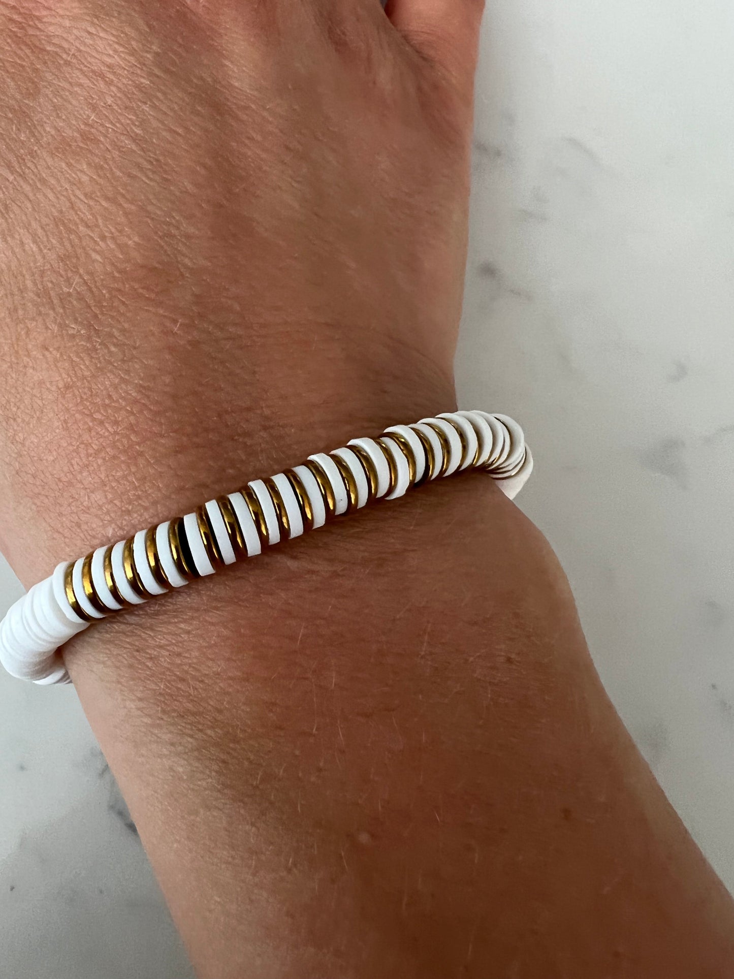 Gold and white heishi bead bracelet.