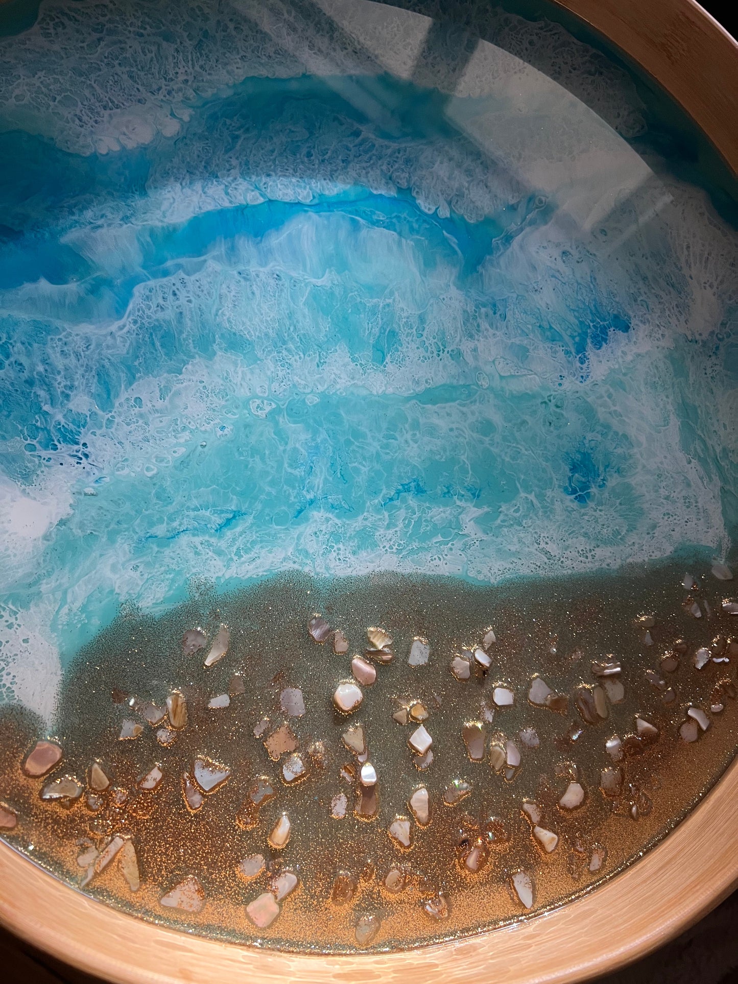 Large round bamboo serving tray with resin ocean