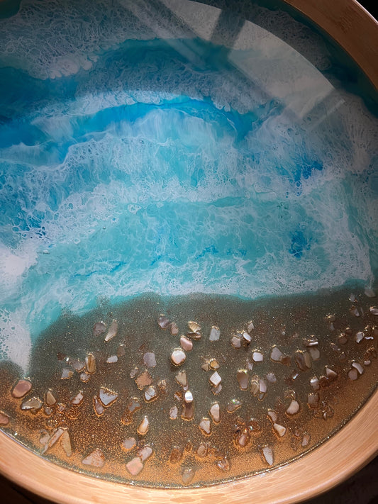 Large round bamboo serving tray with resin ocean