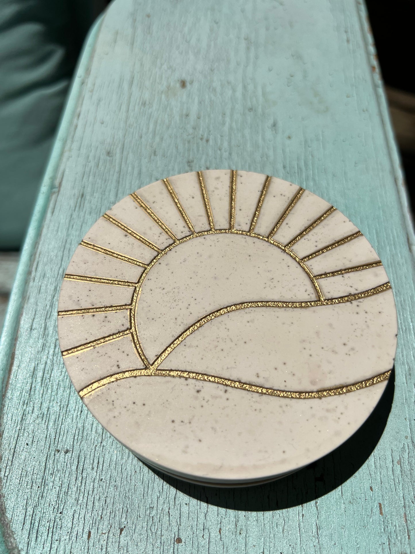 Concrete look gold sun coasters