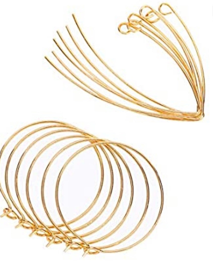 Sparkly resin lip 👄 earrings dangling from 14k gold plated hoops or danglers.