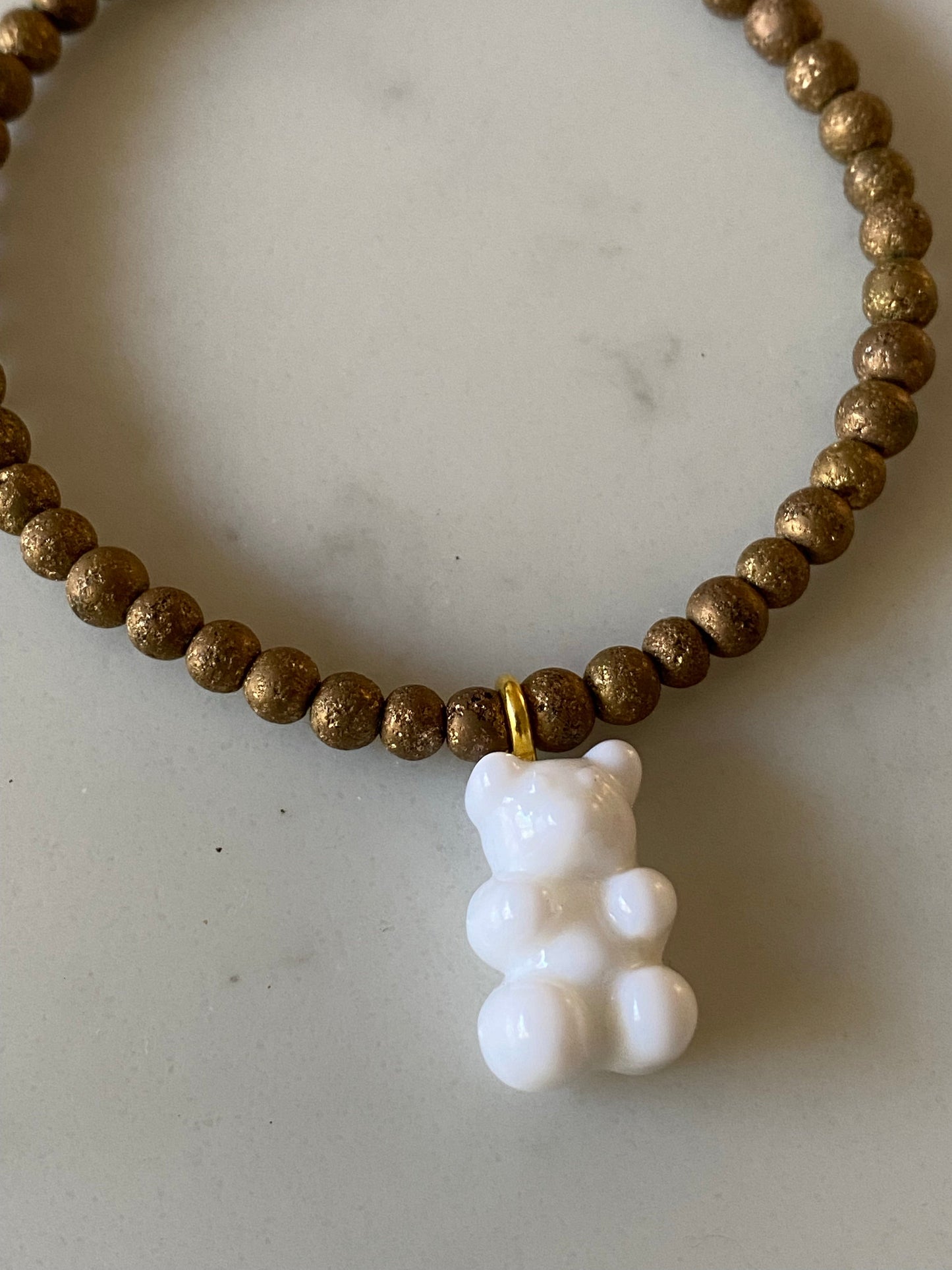 Bracelet with resin charm and gold filled charm.