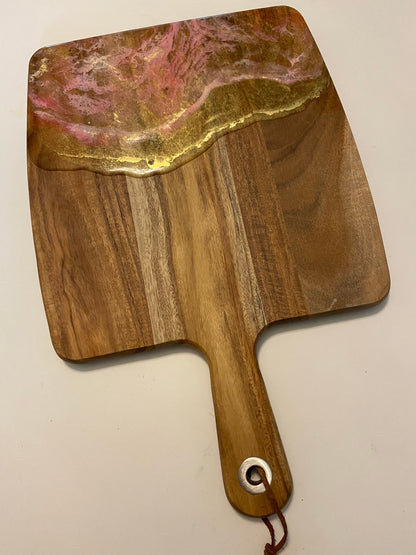 Gold and pink resin cheese board.