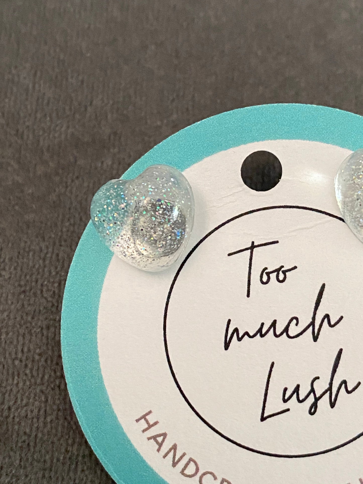 Clear sparkly resin heart studs. (One pair)