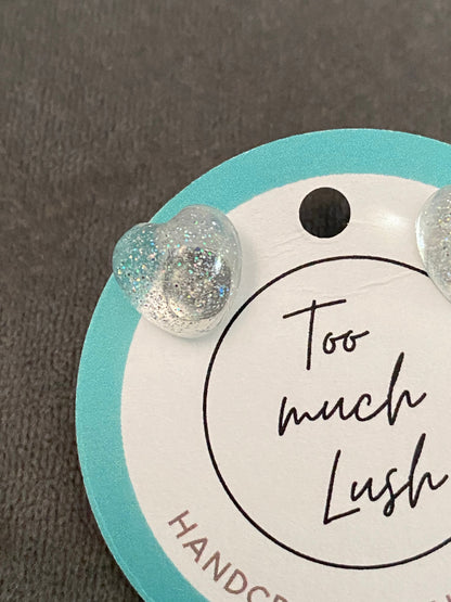 Clear sparkly resin heart studs. (One pair)