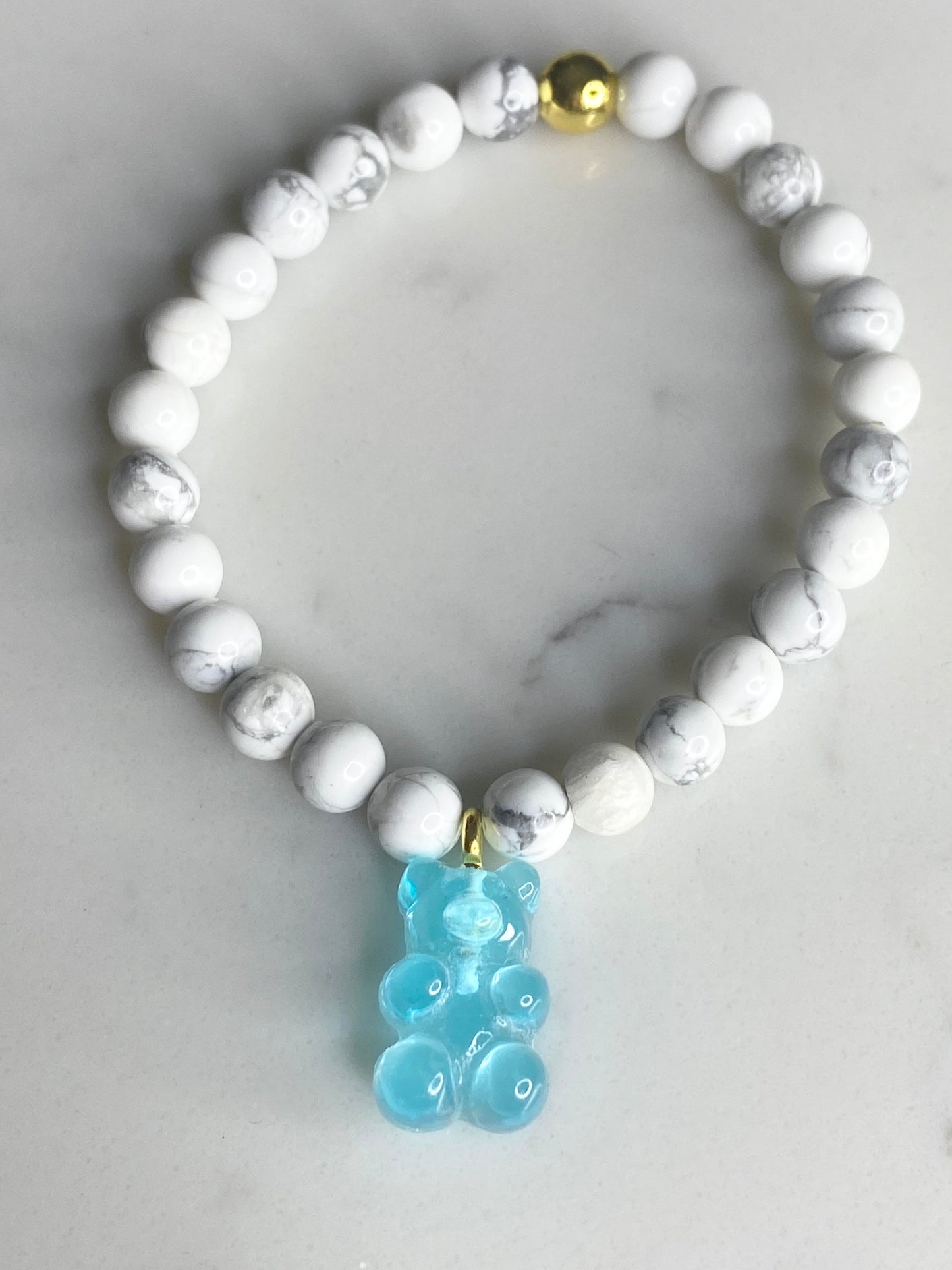 Natural gemstone bracelet with blue resin gummy bear.