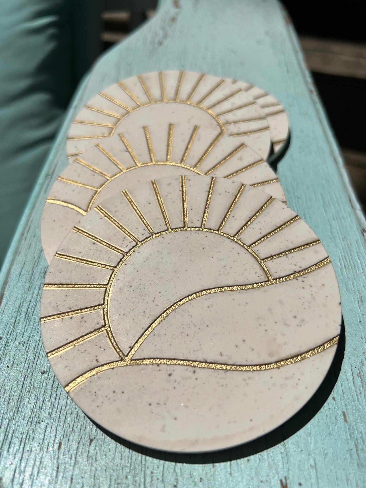 Concrete look gold sun coasters