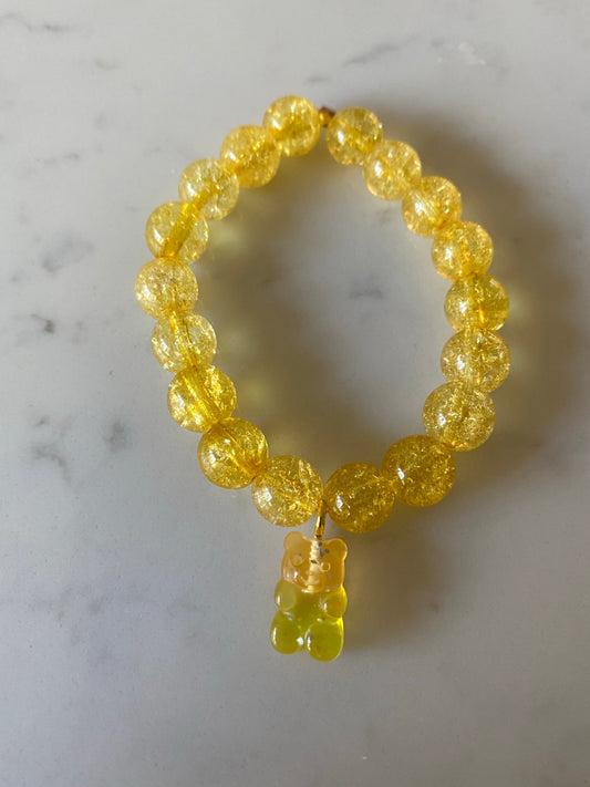 Gemstone bracelet with resin gummy bear charm.