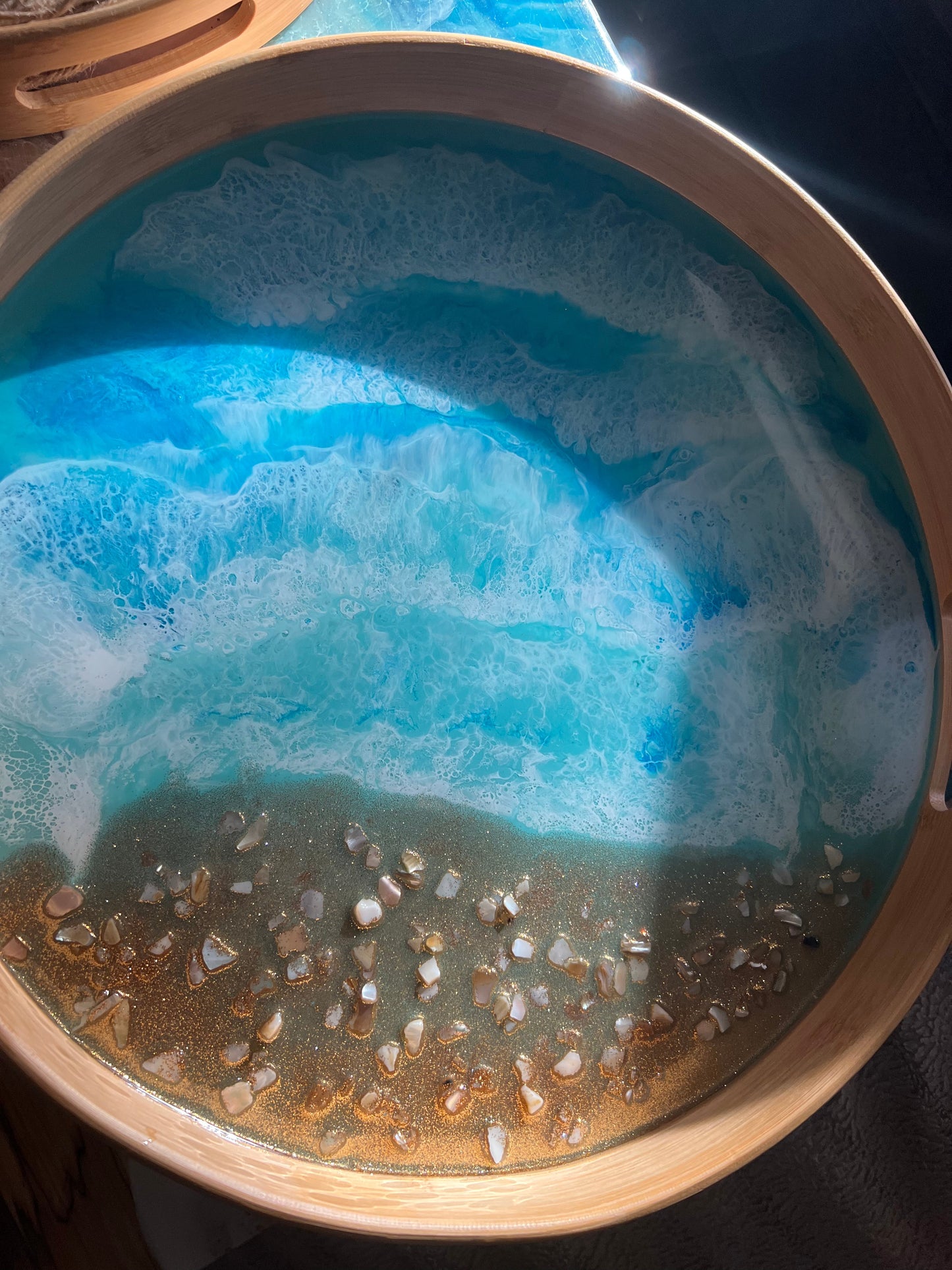 Large round bamboo serving tray with resin ocean