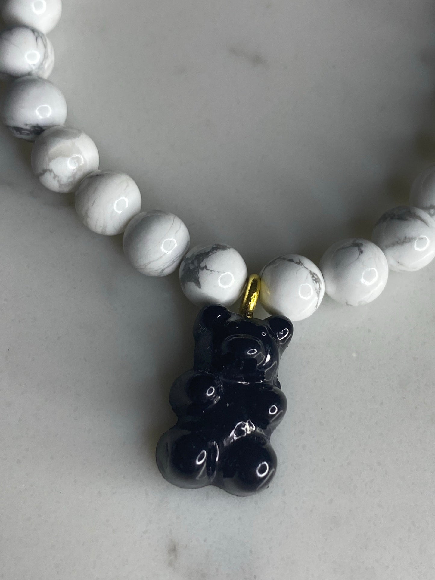 Natural gemstone bracelet with black resin gummy bear.