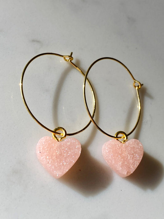 Hand poured mini pale pink resin hearts on 14k gold plated hoops