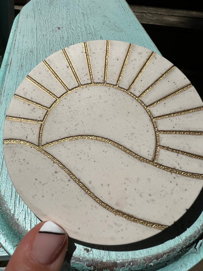 Concrete look gold sun coasters