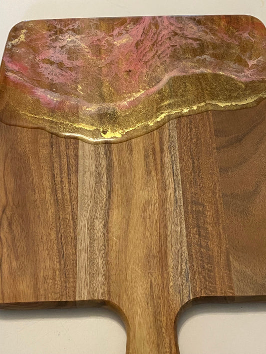 Gold and pink resin cheese board.