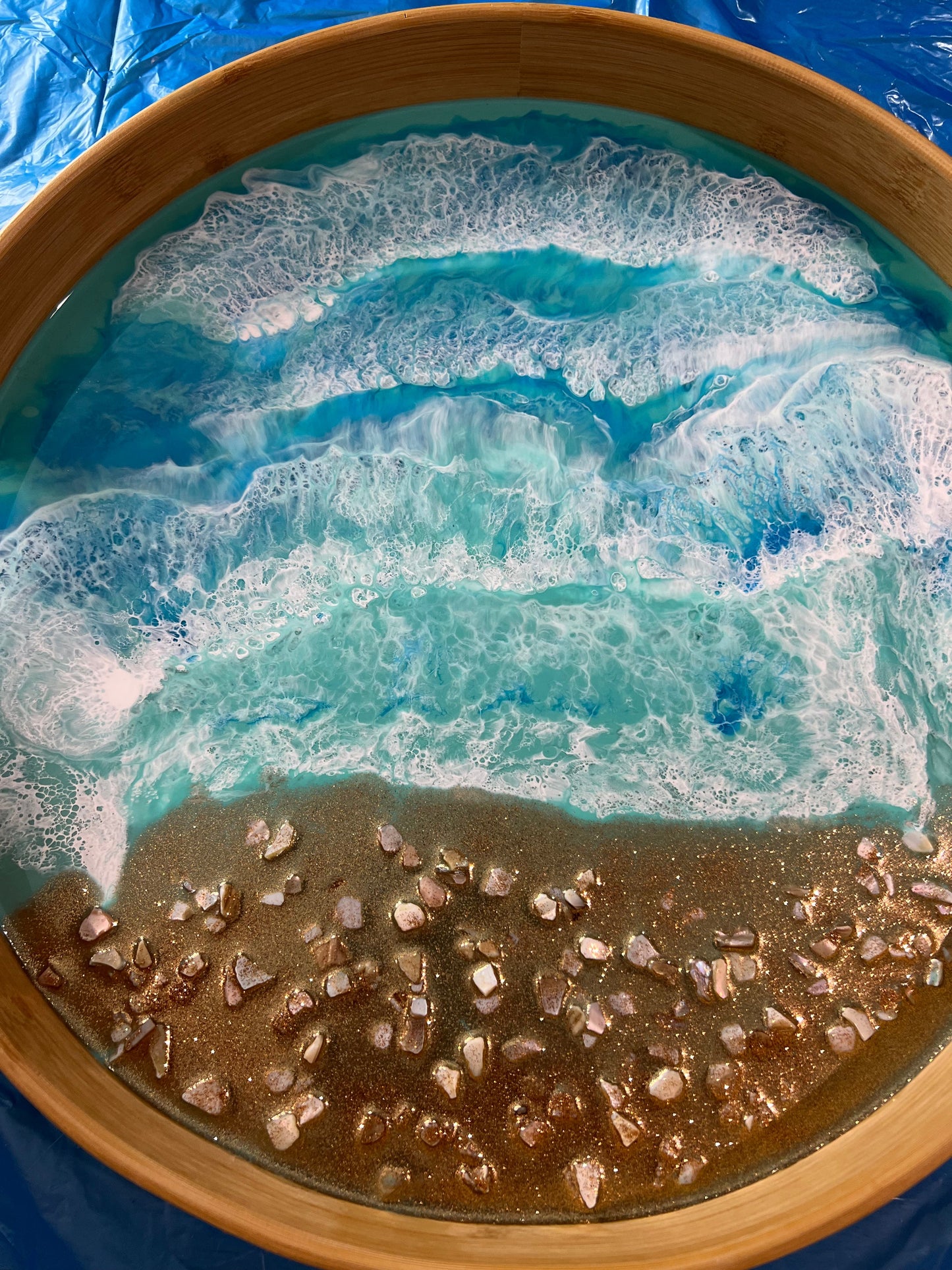 Large round bamboo serving tray with resin ocean