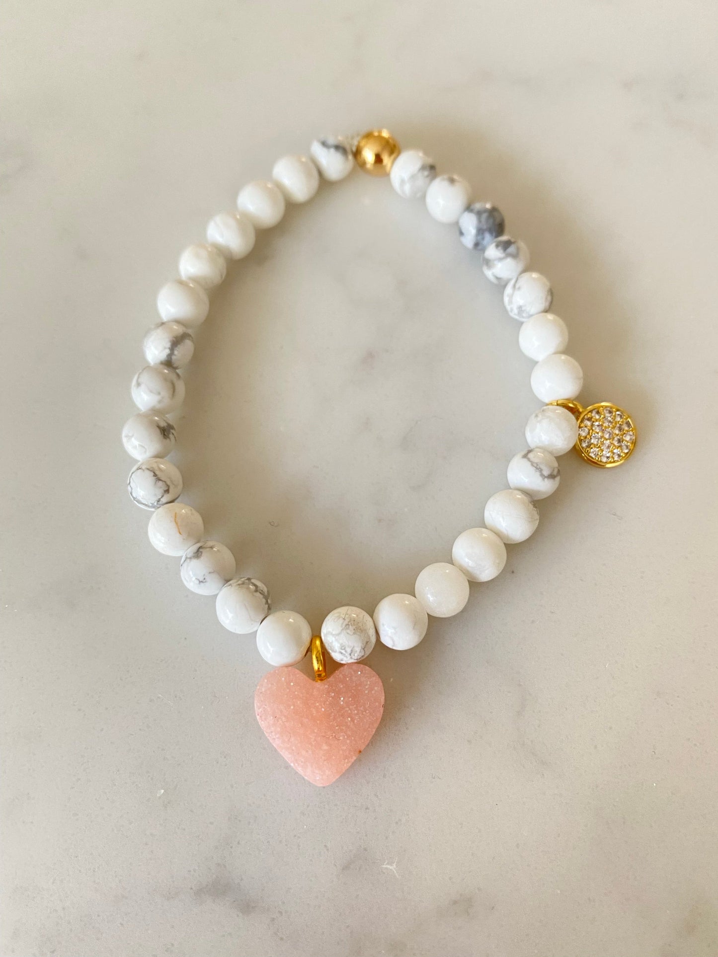 Natural gemstone bracelet with micropave gold plated charm and resin heart charm.